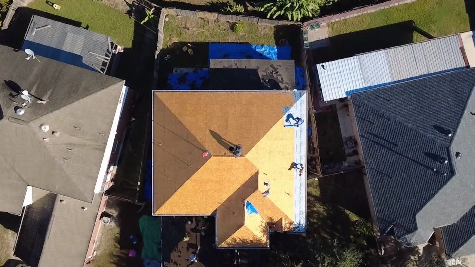 November 4. Straight down — the deck bare, the first run of underlayment starting at the edge.