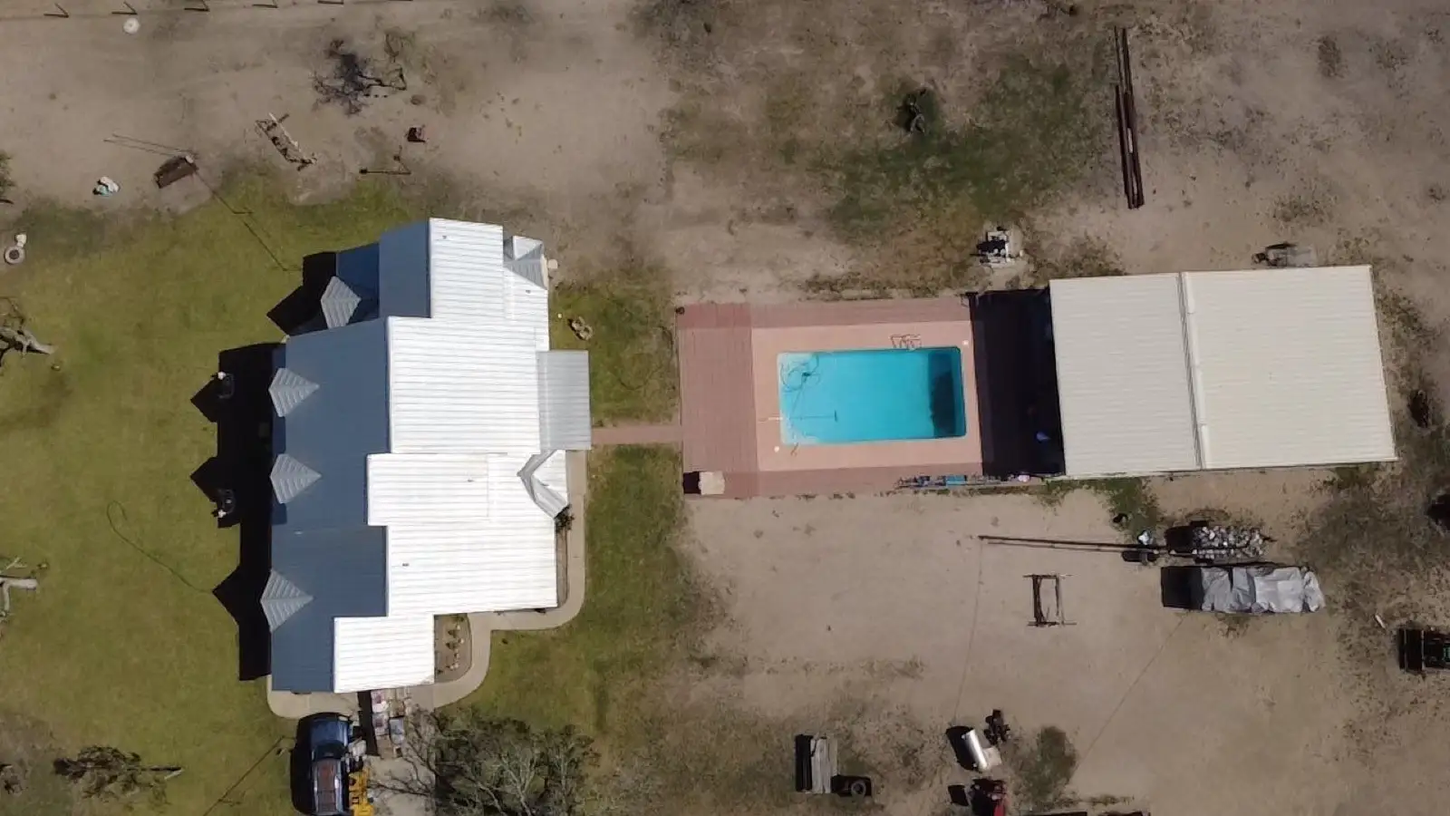 November 14. Straight down: the house under its original metal, the pool, the outbuildings.