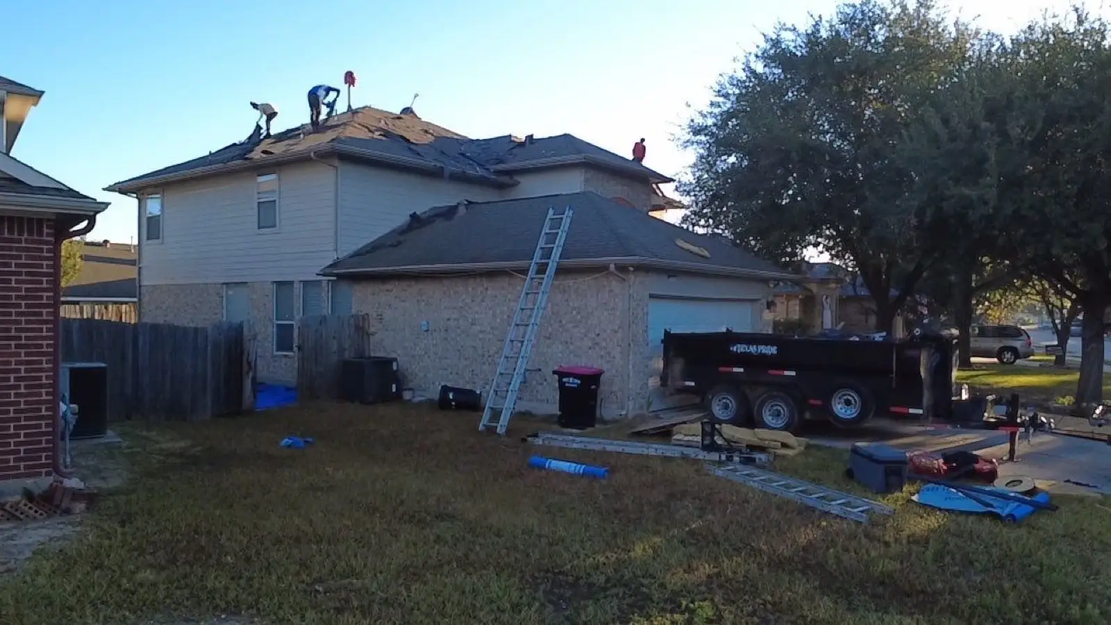 November 4, first light. Ladders set, trailer in the drive, crew already on the ridge.