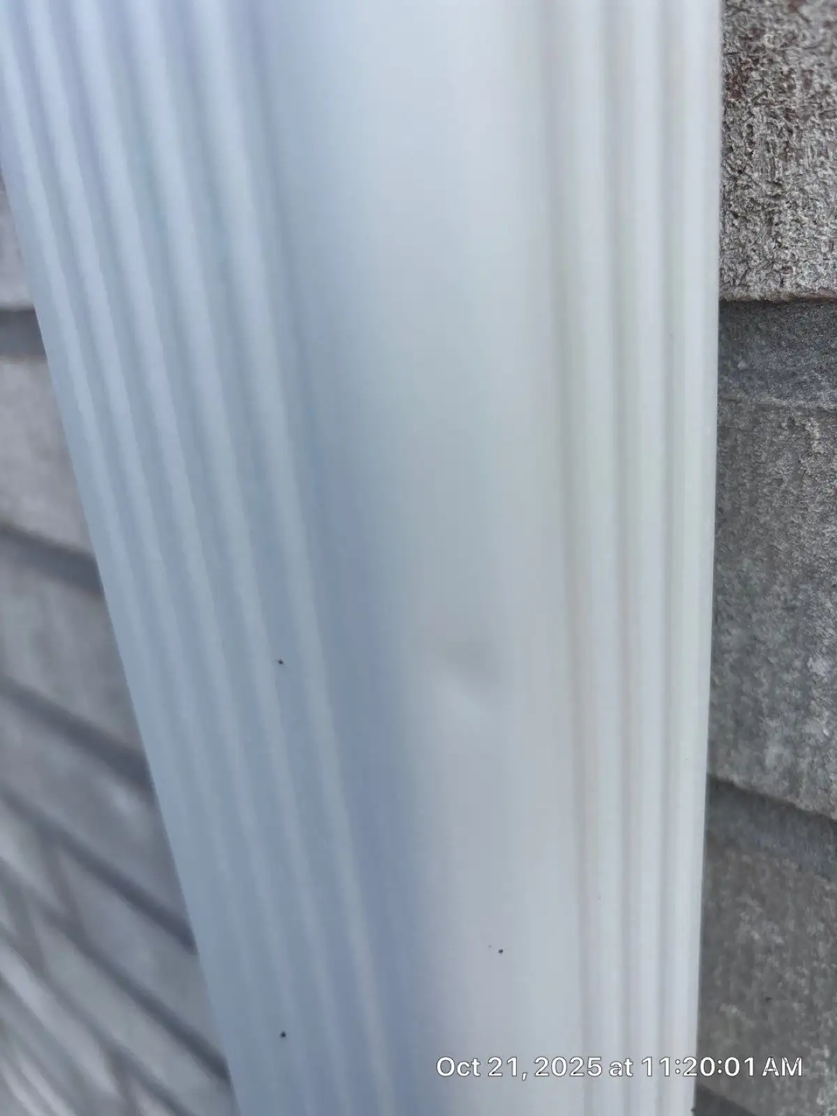 October 21. A downspout at the front wall, dented.