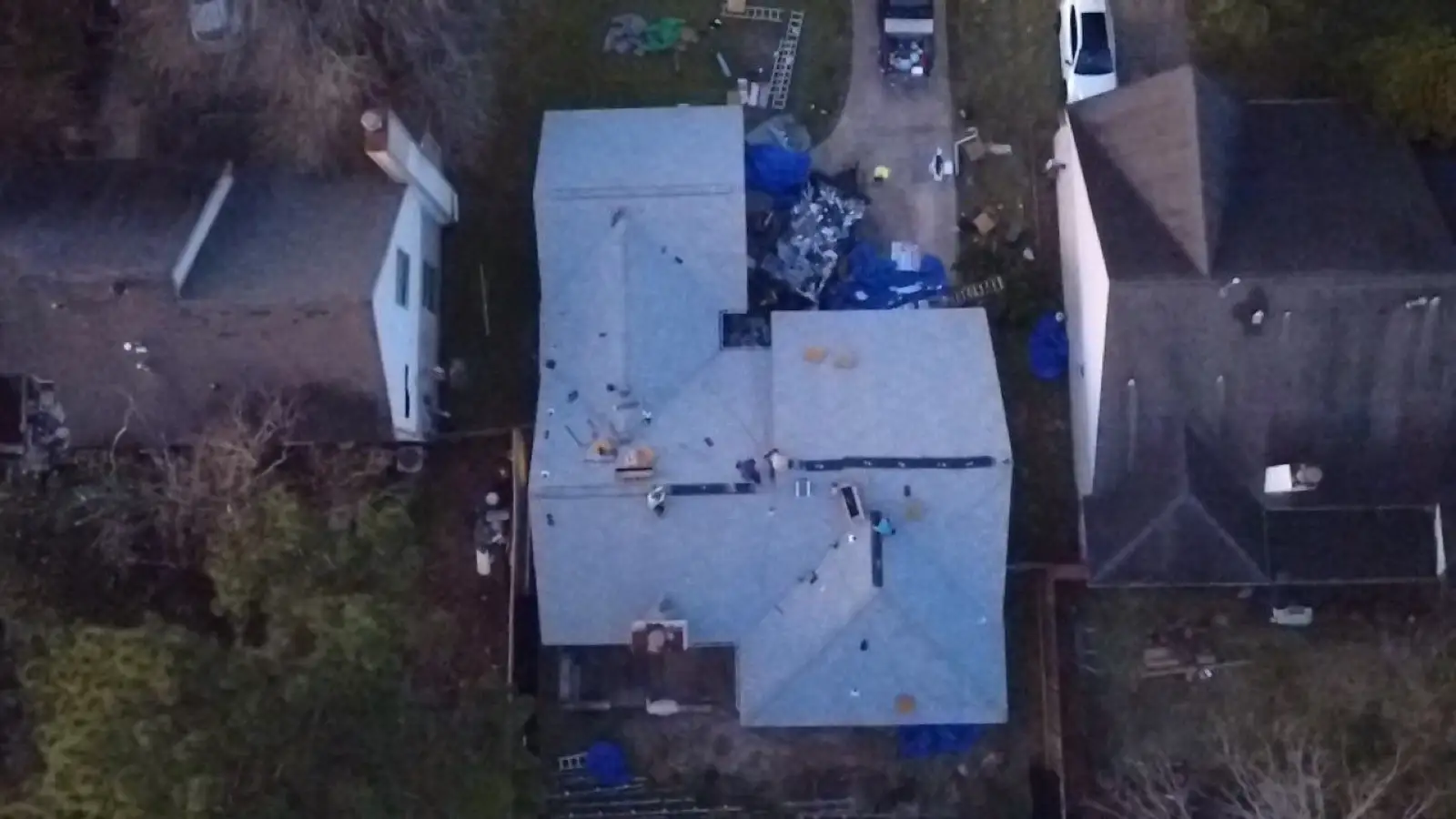 February 23, dusk. The day's last drone pass — the build still underway below.