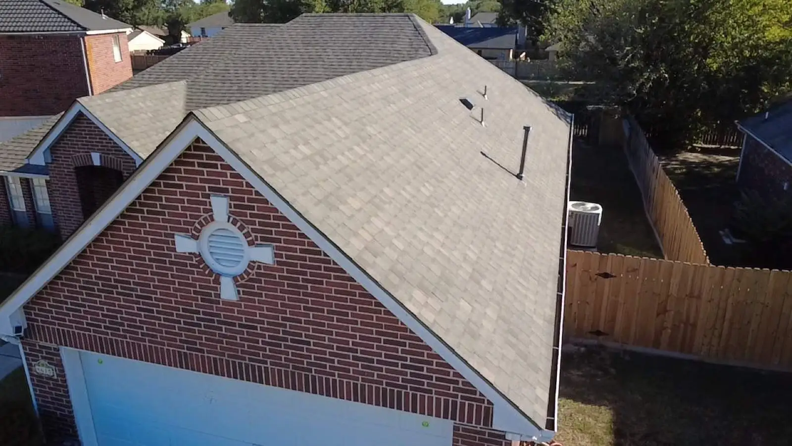 October 21. The garage gable — the new field around the brick vent medallion.