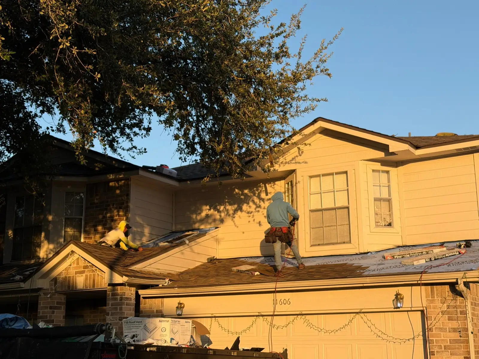 December 18, late day. The crew working the front slope as the light turns gold.