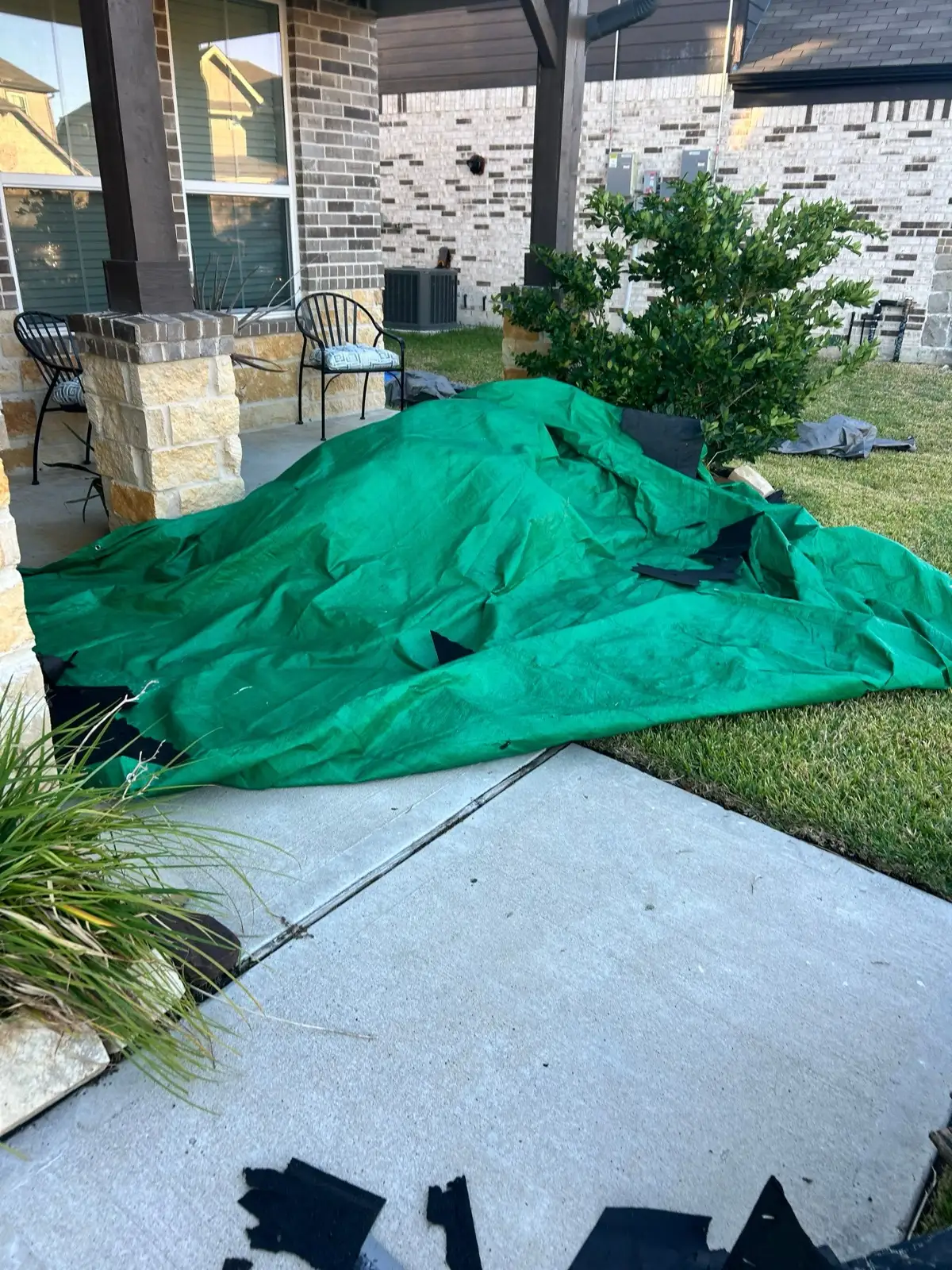 October 29. The back patio and beds under tarps, catching debris before it lands.