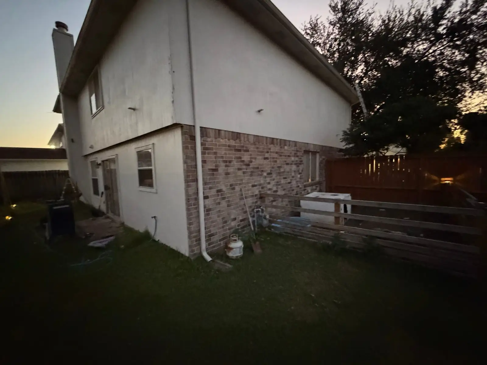 December 18, dusk. The magnetic sweep — combing the lawn for nails in the dark.