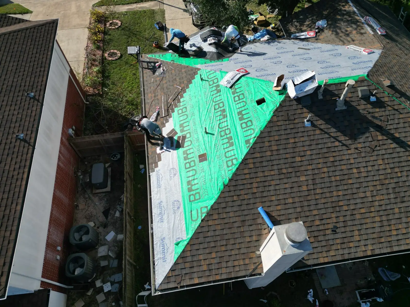 December 18. Plane by plane, the green disappears under new shingles.