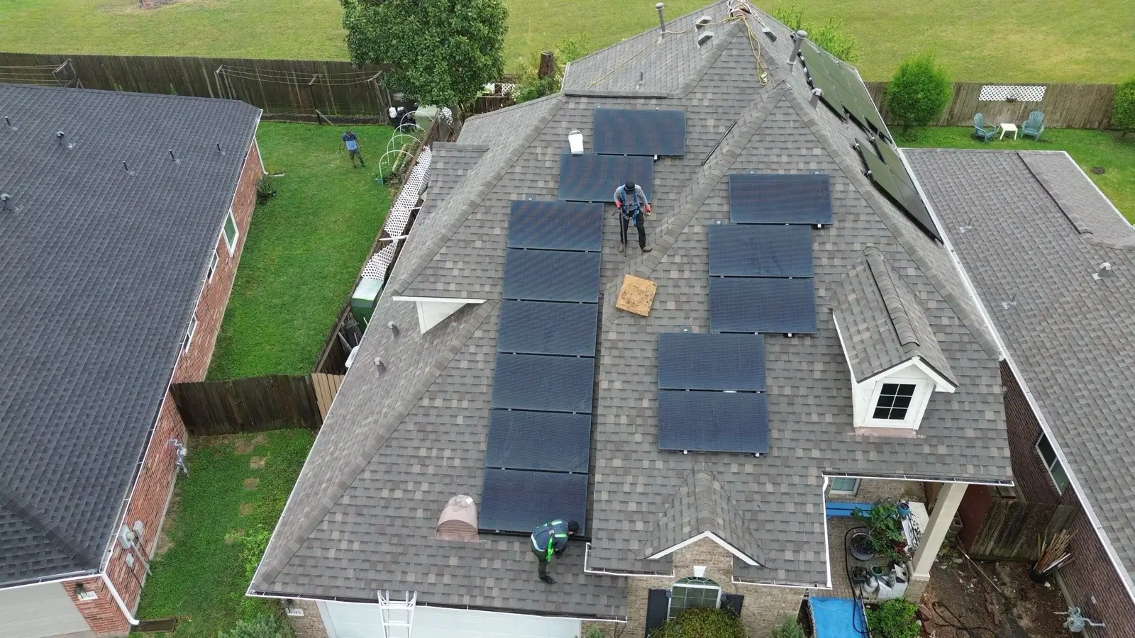 March 5. Setting panels on the new roof, harness on, row by row.