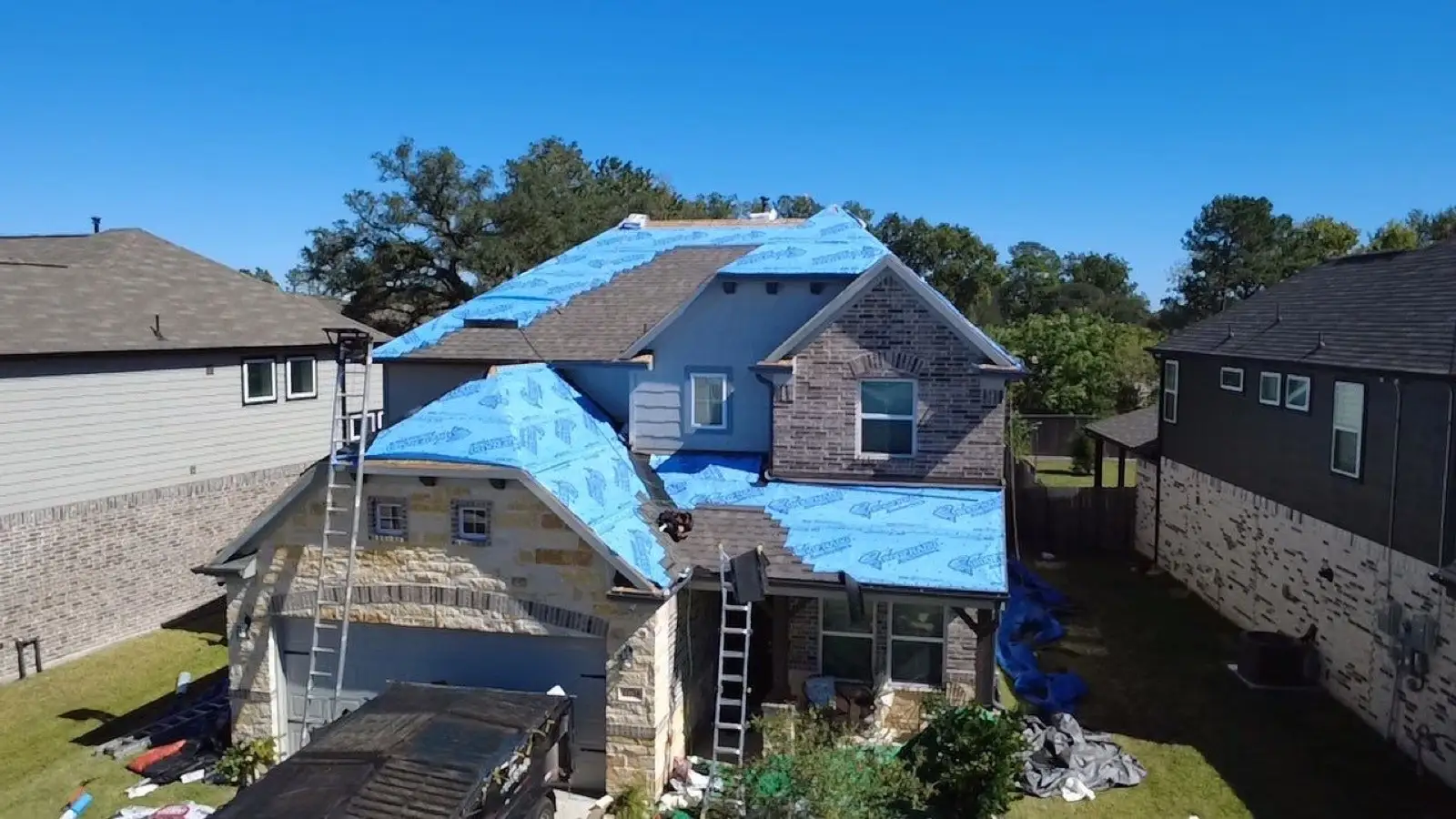 October 29. Underlayment over the upper slopes while shingles start on the lower roof.