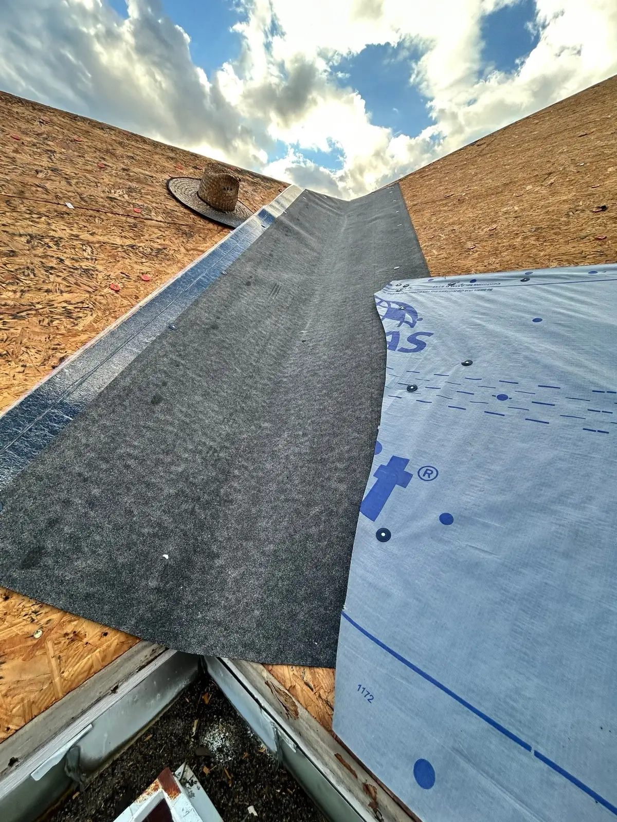 October 17. A valley re-lined — membrane and underlayment layered down the run.